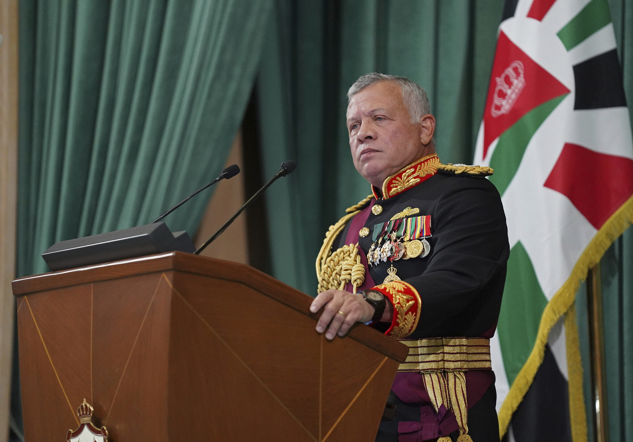 In this photo released by the Royal Hashemite Court, Jordan's King Abdullah II gives a speech during the inauguration of the 19th Parliament’s non-ordinary session, in Amman Jordan, Thursday, Dec. 10, 2020. (Yousef Allan/The Royal Hashemite Court via AP)