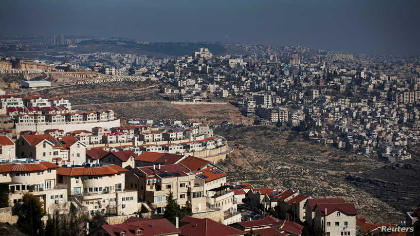 FILE PHOTO: A general view picture shows the Israeli settlement of Efrat (L) in the Gush Etzion settlement block as Bethlehem is seen in the background, in the Israeli-occupied West Bank January 28, 2020. REUTERS/Ronen Zvulun/File Photo