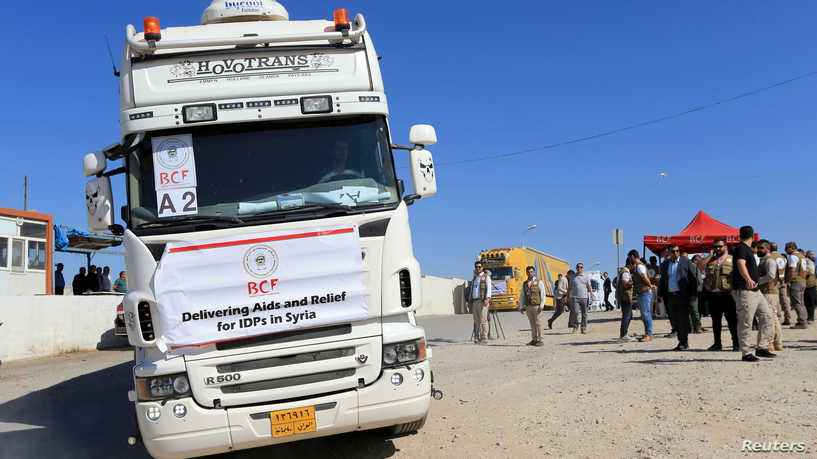 A truck loaded with humanitarian aid is seen heading to Syria for displaced families who fled violence, at the Iraqi-Syrian border crossing in Fish-Khabur, Iraq October 15, 2019. REUTERS/Ari Jalal