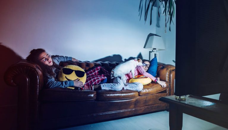 original_two-girls-and-a-dog-are-napping-in-front-of-a-tv
