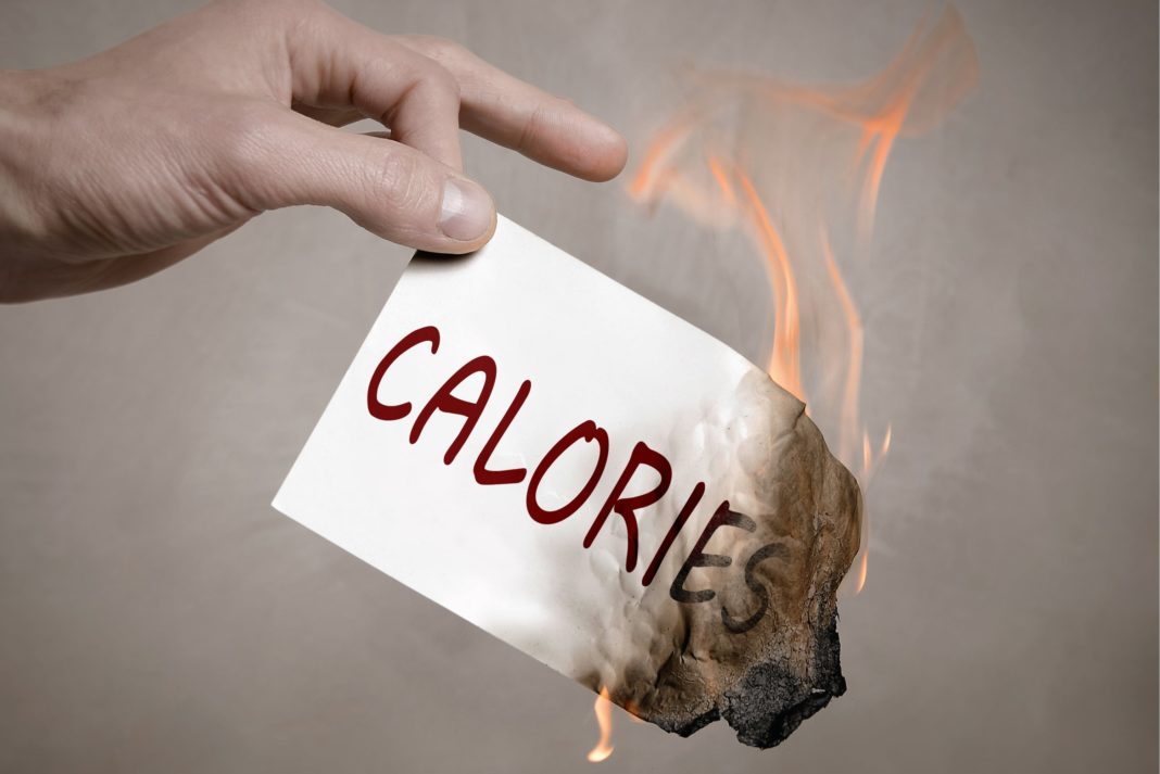47204c01-burning-calories-hand-holding-paper