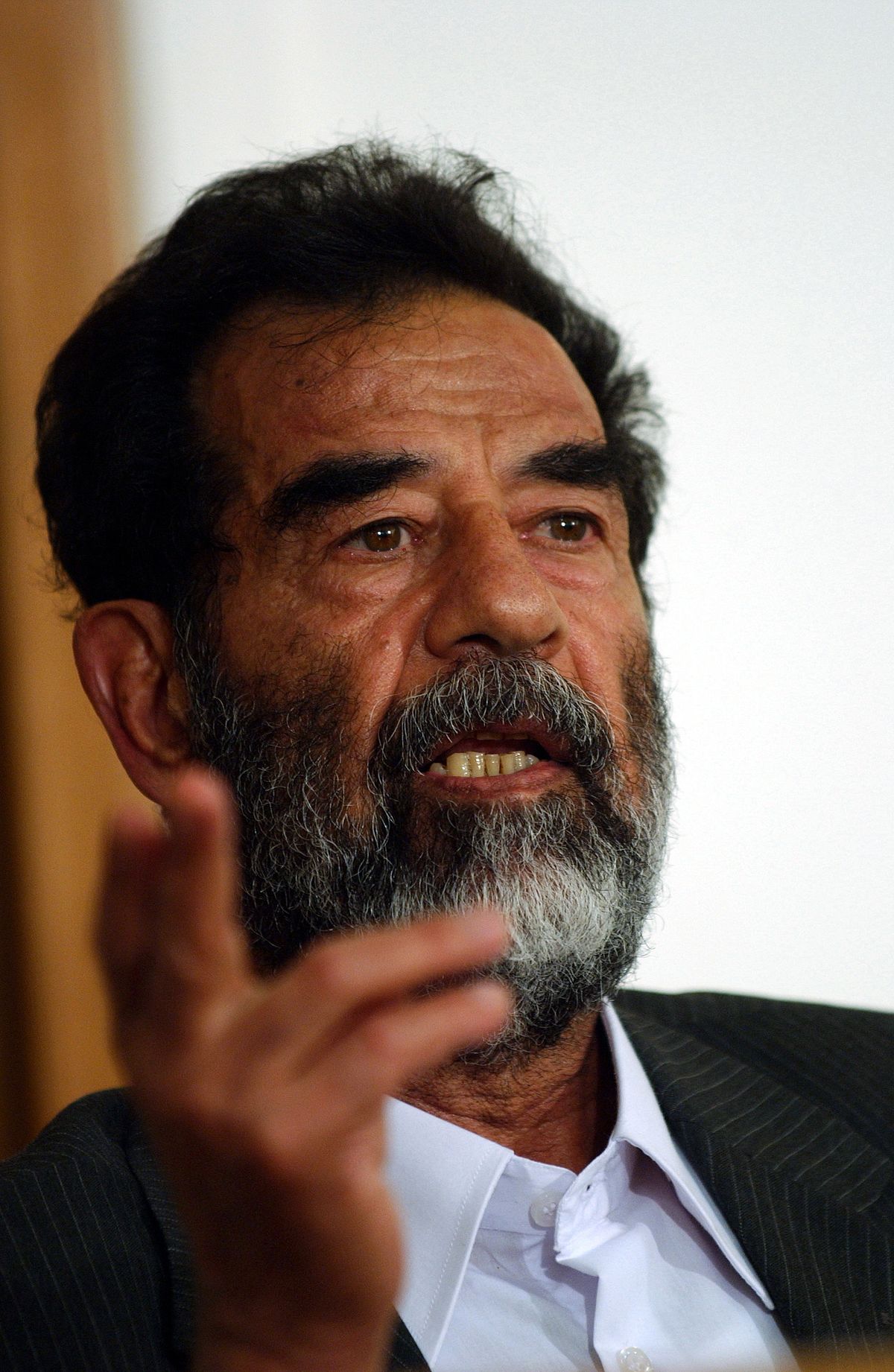 1200px-Saddam_Hussein_at_trial,_July_2004