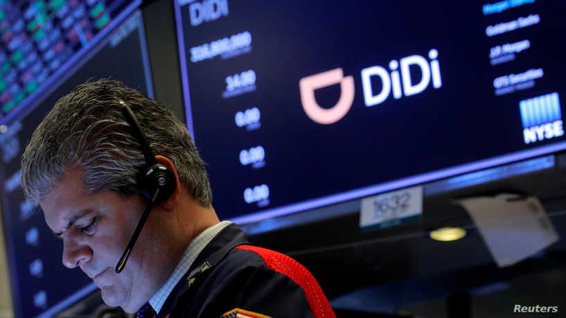 FILE PHOTO: A trader works during the IPO for Chinese ride-hailing company Didi Global Inc on the New York Stock Exchange (NYSE) floor in New York City, U.S., June 30, 2021.  REUTERS/Brendan McDermid/File Photo
