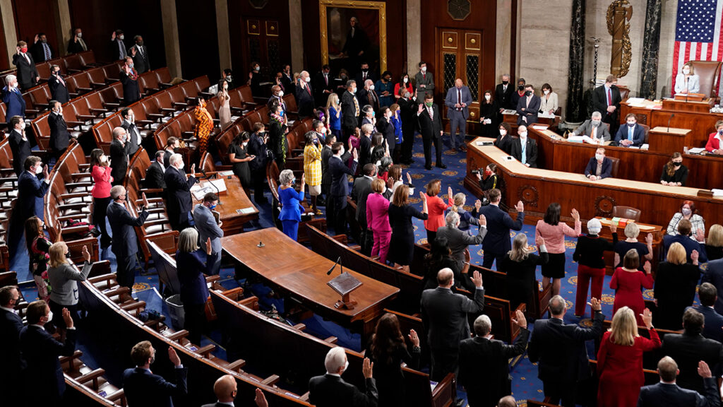 Democratic members of the US House of Representatives take their oath of office administered by Speaker of the House Nancy Pelosi on the floor of the House Chamber during the first session of the 117th Congress on Capitol Hill in Washington, DC, January 3, 2021. (Photo by ERIN SCOTT / POOL / AFP) (Photo by ERIN SCOTT/POOL/AFP via Getty Images)
