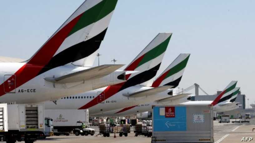 An Emirates Airlines Boing 777 plane unload a coronavirus vaccine shipment at Dubai International Airport on February 1, 2021 as key transport hub Dubai announced an initiative to accelerate the delivery of coronavirus vaccines, particularly to developing nations. - The Vaccine Logistics Alliance, which includes Dubai-based Emirates airline and global logistics giant DP World, is designed to "speed up distribution of Covid-19 vaccines around the world through the emirate". The alliance will "support" the World Health Organization's Covax initiative to distribute two billion vaccine doses, the Dubai Media Office said in a statement, without specifying how many doses it would deliver. (Photo by Karim SAHIB / AFP)