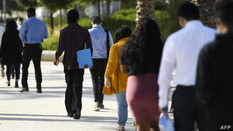People wait in line to attend a job fair for employment with SoFi Stadium and Los Angeles International Airport employers, at SoFi Stadium on September 9, 2021, in Inglewood, California. - Fewer Americans made new claims for unemployment benefits last week than at any point since the Covid-19 pandemic began, according to government data released on September 9, the latest sign of progress in the job market following last year's mass layoffs. (Photo by Patrick T. FALLON / AFP)