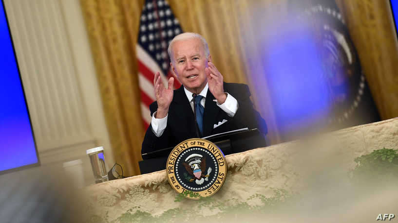 US President Joe Biden speaks as he meets with members of his administration on efforts to lower prices for working families at the East room of the White House, in Washington, DC on January 24, 2022. (Photo by Brendan Smialowski / AFP)