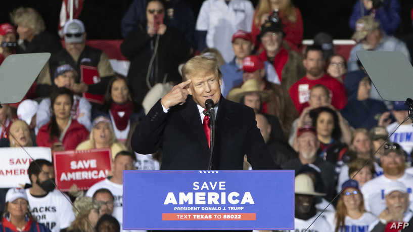 Former US President Donald Trump gestures as he speaks during a "Save America" rally in Conroe, Texas on January 29, 2022. (Photo by Mark Felix / AFP)