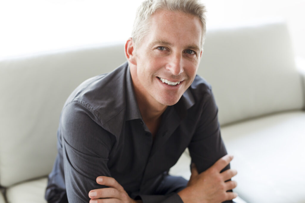 A Portrait of single 40s man sitting in sofa