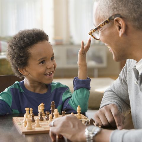 grandfather-and-grandson-playing-chess-together-royalty-free-image-1587985959