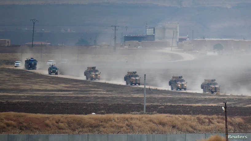 Turkish and Russian military vehicles return following a joint patrol in northeast Syria, as they are pictured near the Turkish border town of Kiziltepe in Mardin province, Turkey, November 1, 2019. REUTERS/Kemal Aslan