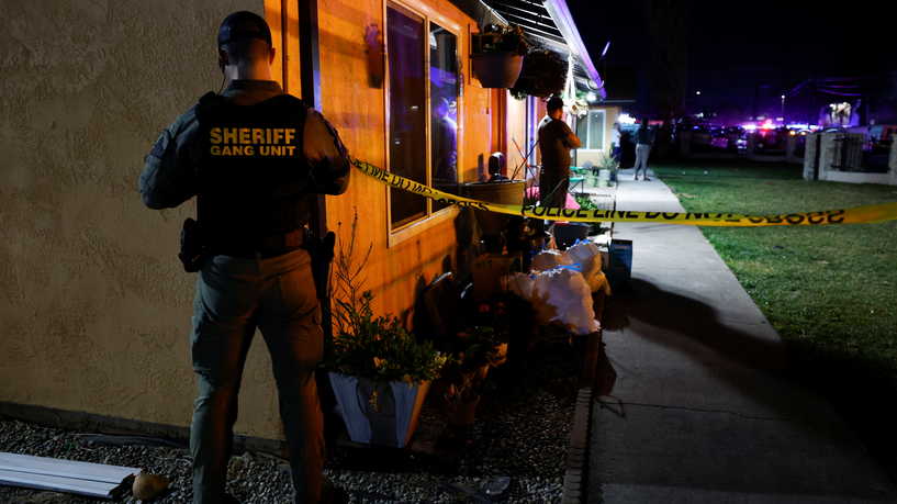 A sheriff's deputy puts up crime scene tape following a shooting at a church in Sacramento, California, U.S., February 28, 2022. REUTERS/Fred Greaves