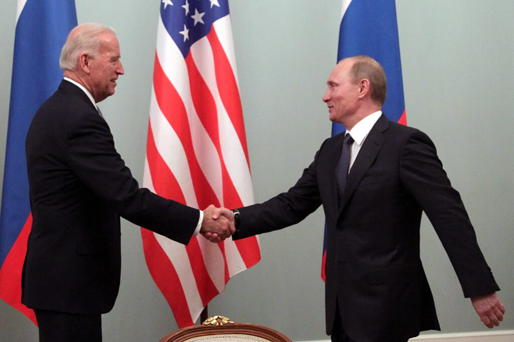 epa08884610 Then US Vice President Joe Biden (L) shakes hands with then Russian Prime Minister Vladimir Putin during their meeting in Moscow, Russia, 10 March 2011 (reissued 15 December 2020). Russian President Vladimir Putin congratulated Joe Biden for his victory in the US presidential election in a telegram published on the Kremlin's website on 15 December 2020.  EPA-EFE/MAXIM SHIPENKOV