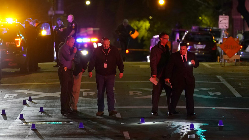 Authorities search area of the scene of a mass shooting with multiple deaths in Sacramento, Calif. Sunday, April 3, 2022. (AP Photo/Rich Pedroncelli)
