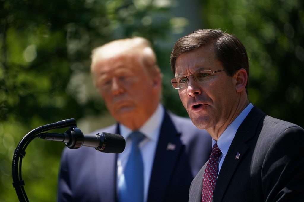 (FILES) In this file photo US Defense Secretary Mark Esper, with US President Donald Trump, speaks on vaccine development on May 15, 2020, in the Rose Garden of the White House in Washington, DC. - President Donald Trump on November 9, 2020 announced by tweet that he had fired his defense secretary Mark Esper, further destabilizing a government already navigating Trump's refusal to concede election defeat to Democrat Joe Biden. "Mark Esper has been terminated. I would like to thank him for his service," Trump said on Twitter, announcing his replacement by Christopher Miller, the current head of the National Counterterrorism Center. (Photo by MANDEL NGAN / AFP)